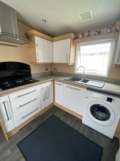 The same kitchen with the units painted white